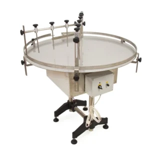 Rundbord i rostfritt stål med justerbara ledstänger för effektiv matning av glasburkar i tappningslinje.